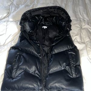 Black hooded puffer vest.